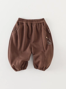Kids brown cotton joggers with elastic waist and white house graphic print on the leg