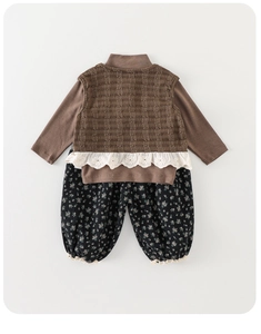 Detail of girls' 3-piece autumn set featuring lace vest, brown top, and floral pants