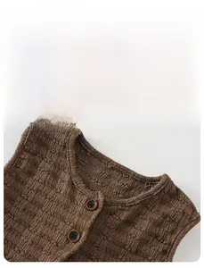 Detail view of brown waffle knit fabric collar with high-quality round buttons