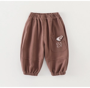 Detail of dark brown toddler sweatpants with elastic waist and 3D cartoon animal pocket