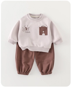 Detail of baby boys cotton sweatshirt set showing ribbed cuffs and cute dog print