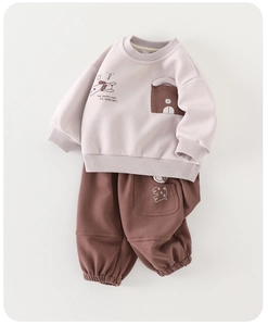 Detailed flat lay of boys casual sweatshirt and brown joggers with puppy print