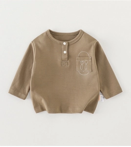 Detailed close-up of khaki cotton baby t-shirt featuring a cutlery embroidered pocket