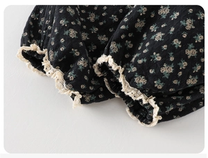 Close-up of floral cotton fabric with elegant off-white crochet lace trim and elastic cuff