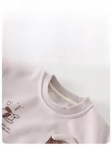 Detail view of the ribbed crew neckline and high-quality cotton fabric of the toddler sweatshirt