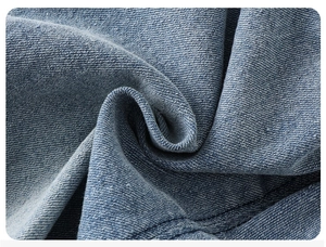 Gros plan détaillé du tissu denim bleu avec couture renforcée à double surpiqûre