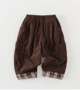 Detail of toddler corduroy trousers with plaid hem lining and elastic waistband