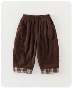 Detail of kids corduroy pants with elastic waist and stylish plaid hem cuffs