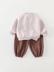 Toddler boy two-piece autumn set with light pink sweatshirt and dark brown jogger pants