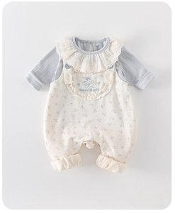 Detail of baby girl floral overalls with cat embroidery and lace collar ribbed top