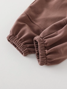 Brown toddler jogger pants showing ribbed ankle cuffs and soft cotton knit fabric detail
