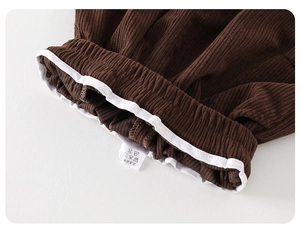 Detail of toddler corduroy pants showing the elastic waistband and inner binding craftsmanship