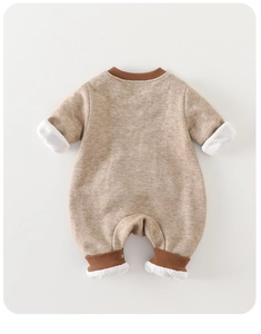 Detail of baby long-sleeve romper featuring khaki texture and brown ribbed cuffs