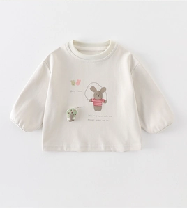 Detail view of the ribbed crewneck and cartoon mice print on cream kids' sweatshirt