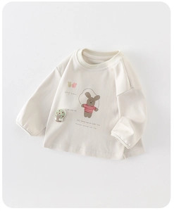 Detail of soft cream kids sweatshirt with cute cartoon bunny print and ribbed crewneck
