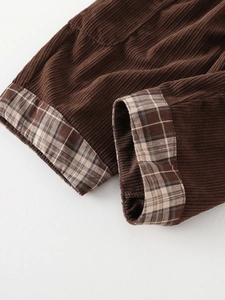 Toddler corduroy trousers in dark brown featuring stylish plaid lined cuffed hems