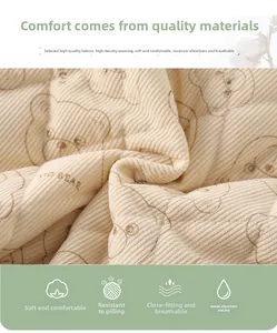 Macro detail of soft beige corduroy fabric featuring Kid Bear print for baby jumpsuits