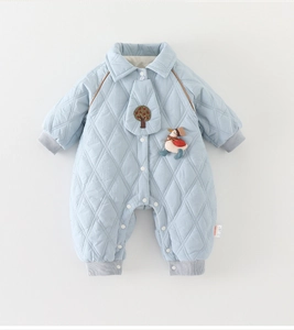 Close-up of light blue quilted baby romper featuring delicate embroidery and rib cuffs