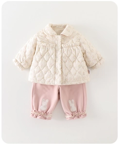 Detailed view of winter baby set with floral quilted jacket and cute bunny patch trousers