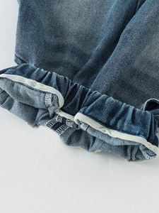 Kids mid-blue wash denim jeans with elastic cuffs and high-quality stitching details