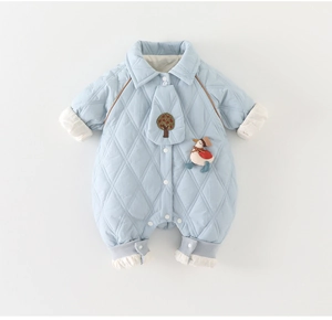 Detail of light blue quilted baby romper featuring cartoon duck patch and rib cuffs