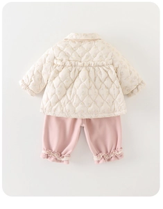 Detailed quilted floral pattern and ruffled neckline on this cozy baby winter outfit