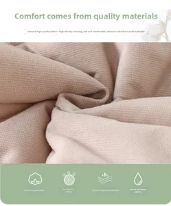Close-up of thick beige knit fabric showing soft texture and breathable mesh weave