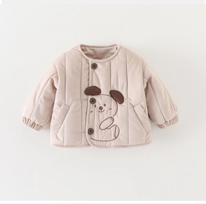 Close-up of padded winter baby jacket with cartoon dog embroidery and brown buttons