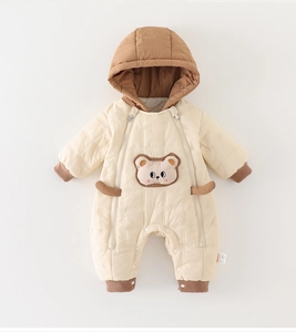Detail of baby winter romper with dual-zipper closure and cute bear embroidery patch