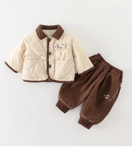 Detail view of winter quilted jacket with corduroy collar and airplane embroidery