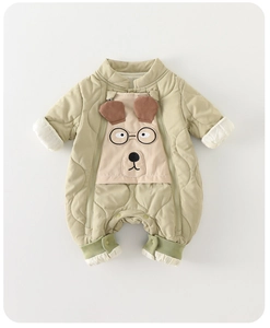 Detailed view of quilted baby romper with cartoon dog embroidery and double zippers