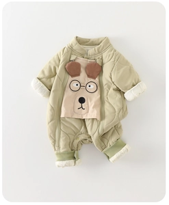 Close-up of quilted baby romper fabric with cute puppy embroidery and double zipper
