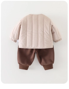 Detailed back view of a beige quilted thermal jacket and dark brown cuffed pants set