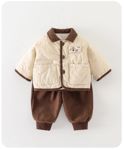 Flat lay of beige quilted toddler jacket and brown corduroy pants for winter wear