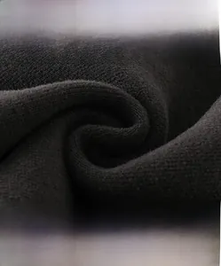 Vue macro du tissu en maille douce haute densité pour pantalons décontractés enfants