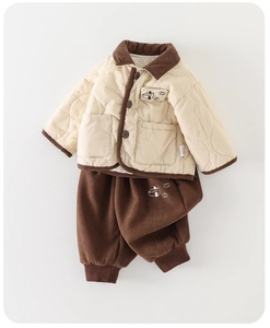 Detailed flat lay of boys beige quilted jacket and brown corduroy pants winter set