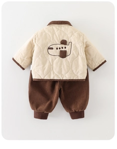 Detail of toddler quilted jacket with airplane embroidery and brown corduroy pants