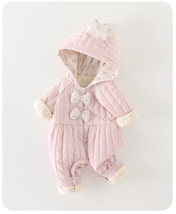 Detail of pink quilted baby romper with floral bows and cute 3D ear hood design
