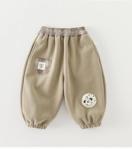 Detail of khaki fleece pants featuring plaid waistband, pocket, and cute panda patch