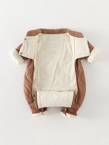Brown and cream quilted baby romper with dual zippers and warm ribbed cuffs