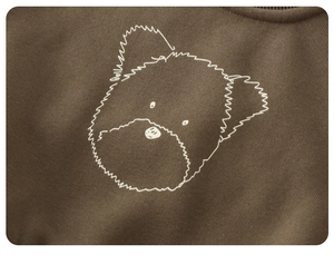 Close-up of a white minimalist dog print on deep brown cotton fleece kid's sweatshirt