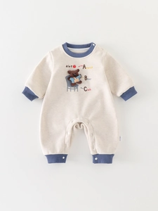 Cute cream-white baby romper with blue ribbed edges and cartoon bear embroidery