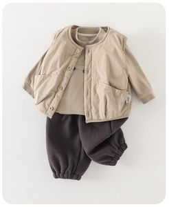 Three-piece kids outfit with quilted khaki vest, long-sleeve shirt, and brown jogger pants