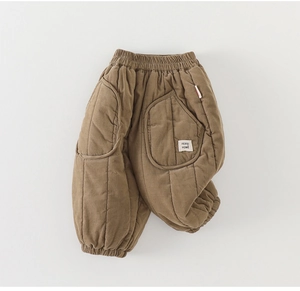 Detail view of brown fleece-lined padded pants for babies featuring vertical quilting and elastic cuffs
