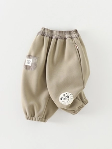 Girls warm fleece casual pants in khaki with plaid waistband and panda patch detail