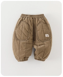 Close-up of quilted warm toddler pants featuring elastic waist and brown padded fabric
