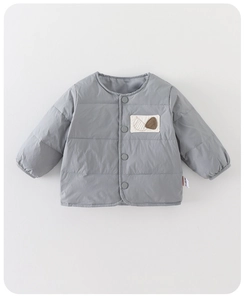 Detail of baby quilted down vest showing gray fabric, buttons and cute chest pocket