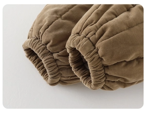 Close-up of windproof elastic ribbed cuffs on toddler corduroy winter padded trousers