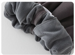 Detail of children's thick fleece lining and elastic waistband on warm winter pants