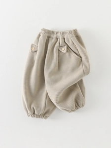 Pantalon d'hiver en velours côtelé beige pour bébés avec taille élastique et bouton